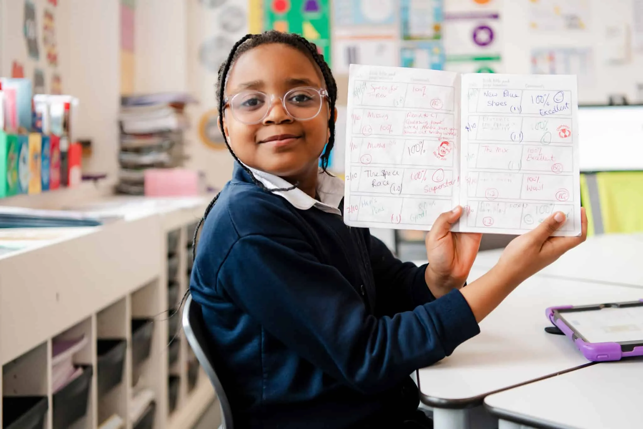 Girl showing book